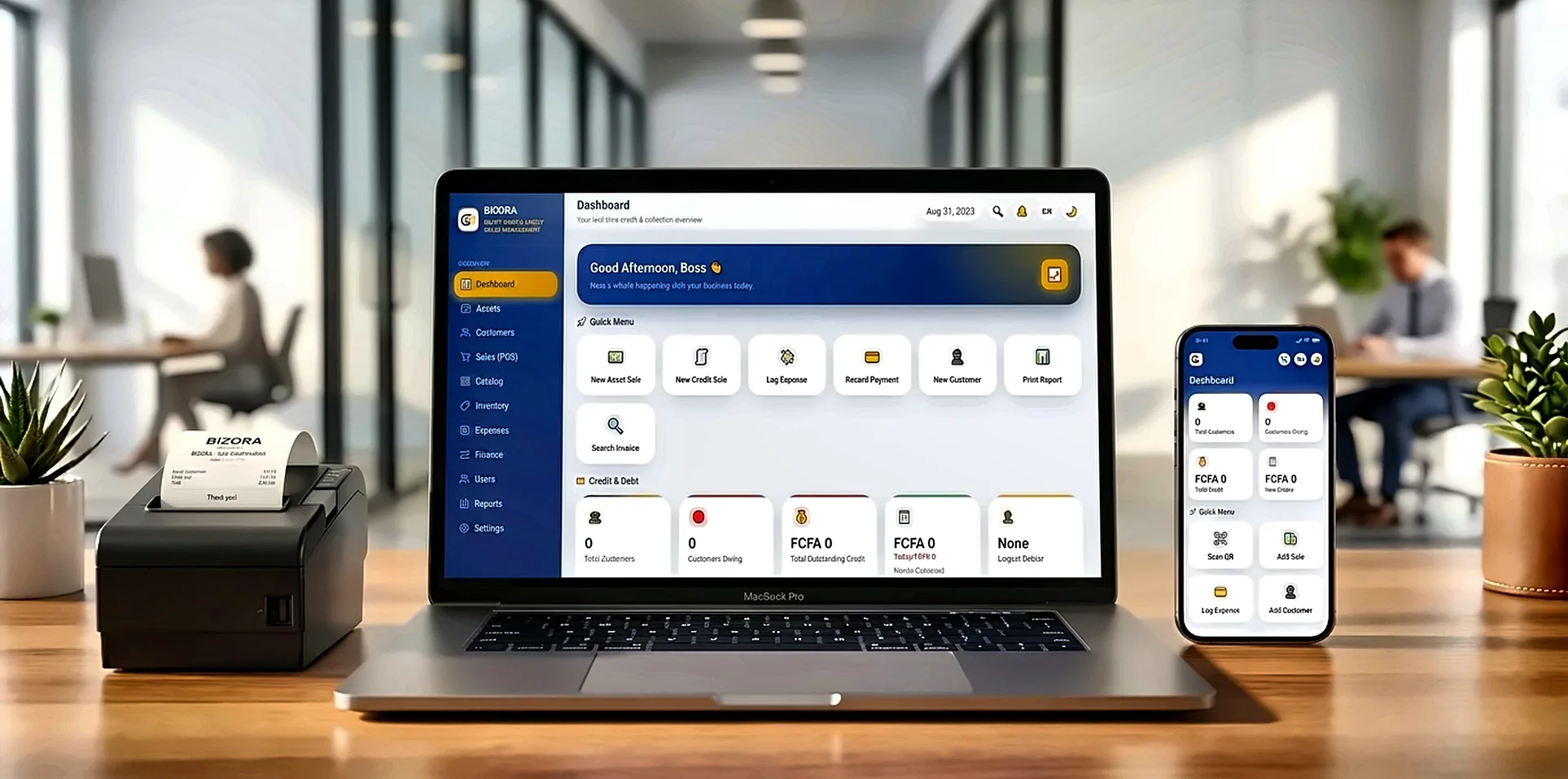 A laptop and a phone side by side on a desk, both displaying the Bizora dashboard, in a bright modern office